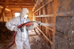 Spraying cellulose insulation